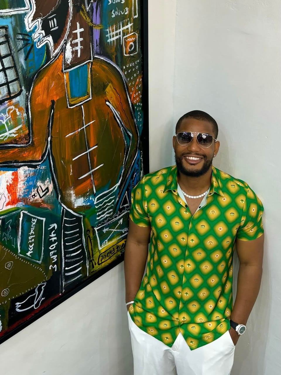 Alexx Ekubo smiling during a casual public appearance